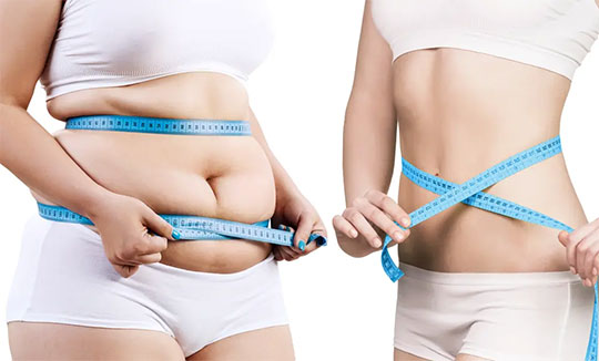 woman measuring stomach before and after weight loss