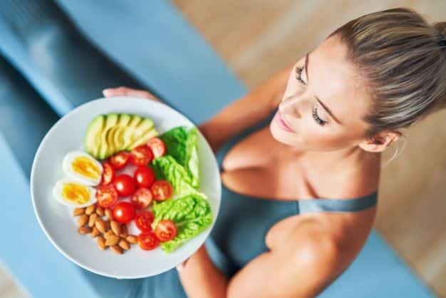 Healthy woman with a salad